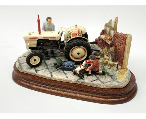 A Border Fine Arts figure group, Like Father Like Son, model no B0859 by Ray Ayres, on wooden base, figure L23cm, with accomp