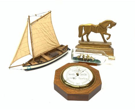 Short &amp; Mason of London aneroid barometer in an octagonal inlaid mahogany case together with a brass door stop in the for