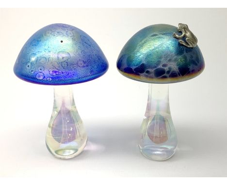A John Ditchfield Glasform mushroom, in irridescent blue surmounted with a frog, H10.5cm, together with another similar John 