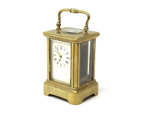 A brass cased miniature carriage clock, the white enamel dial with black Roman numerals, H7cm.  - Condition Report 
