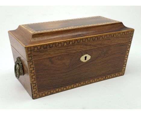 A 19th century rosewood tea caddy, of sarcophagus form with inlaid key fret detail and ivory escutcheon, the hinged cover ope