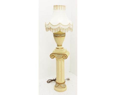 A composite cream Ionic column stand, H68cm, together with a matching table lamp of baluster form with cream tasselled shade,