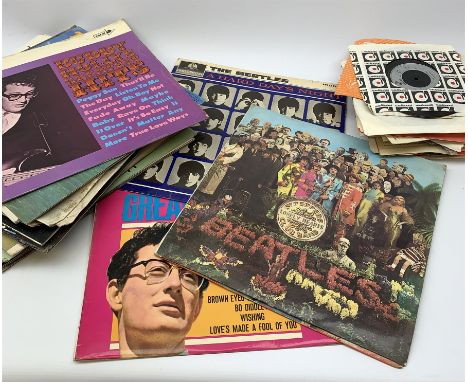 A selection of assorted vinyl records and singles, to include The Beatles Sgt Peppers Lonely Hearts Club Band, The Beatles A 