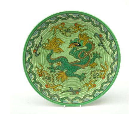 A Charlotte Rhead for Crown Ducal pattern pottery plate, decorated with a green dragon, with printed and painted marks beneat