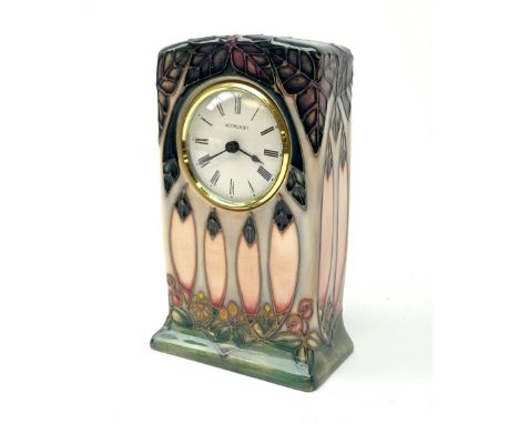 A Moorcroft mantle clock, decorated in the Cluny pattern designed by Sally Tuffin, with impressed and painted marks beneath, 