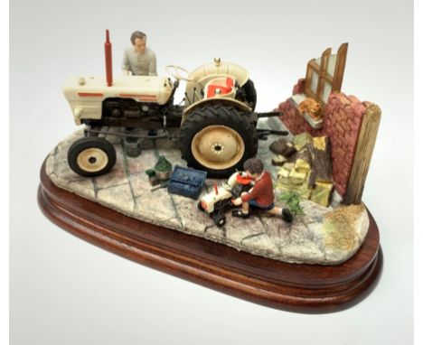 A Border Fine Arts figure group, Like Father Like Son, model no B0859 by Ray Ayres, on wooden base, figure L24cm, with accomp