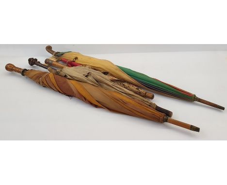 1920's/30's cotton parasol with multicoloured bakelite top on wooden handle, a fabric parasol with natural carved wood handle
