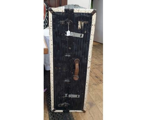 Black and cream painted cabin trunk with fitted interior of shelves and having luggage labels to exterior (worn) 