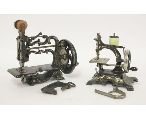 A Weir 55 hand sewing machine,in a mahogany case complete with directions leaflet, anda miniature sewing machine,with a 'pain