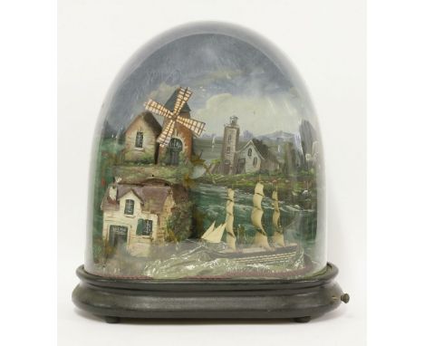 A Victorian musical automaton diorama,modelled as a rotating windmill above a cottage, overlooking a rocking ship in full sai