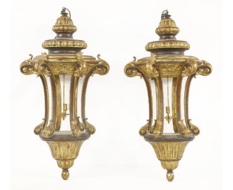 A pair of large Venetian style gilt wood light fittings, with scrolling supports and carved acanthus leaf decoration, each 15