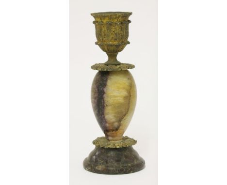 A Blue John candlestick, 19th century, the ovoid body and turned base supporting an ormolu sconce, 15cm high