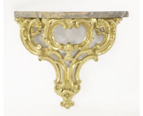 A giltwood and gesso scrolling acanthus leaf wall bracket,with serpentine marble top,53cm wide