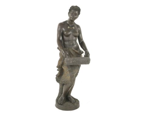 A Goldscheider figure of a Nubian servant,late 19th century, she modelled bare-chested holding a basket, restored through the