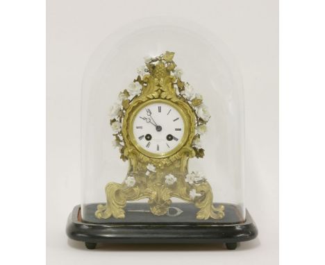 A French gilt bronze mantel clock,19th century, with applied white porcelain flowers, the dial signed 'Vieyres and Repingon, 