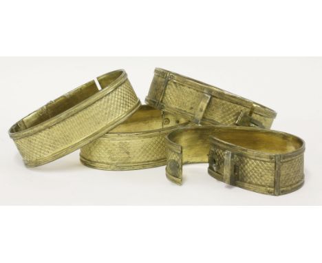 A set of four ormolu curtain tie-backs,18th/19th century, with engine turned decoration,19cm wide (4)