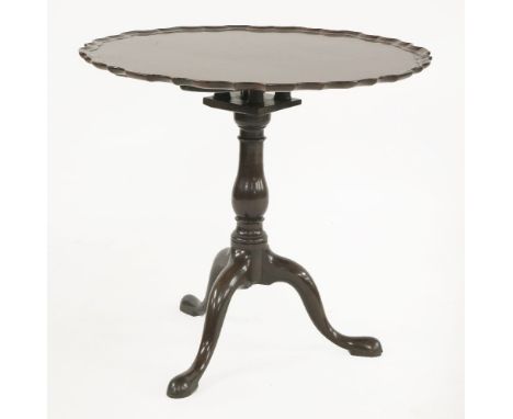 A George III mahogany tripod table,the circular top over a birdcage, over a turned column, on pad feet,80cm diameter73cm high