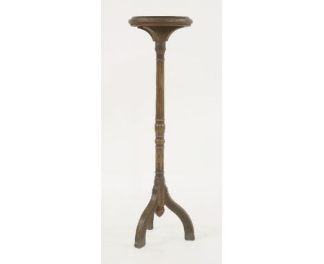 A polychrome decorated torchère,the circular top over a fluted column on a tripod, lead mounted stand,108cm high