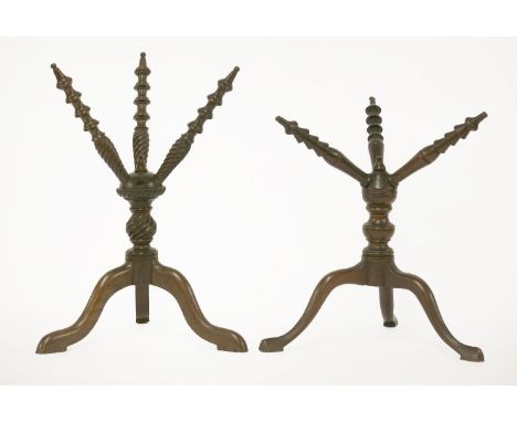 Two mahogany cats,each on a tripod base,42 and 34cm high (2)