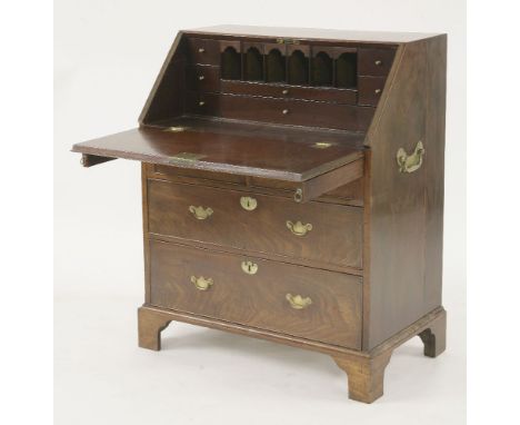 A George II walnut bureau,with fitted interior, over two short and two long drawers on three bracket feet, with brass carryin