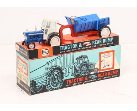 Britains: A boxed Britains Toys, Tractor and Shawnee Poole Rear Dump, Reference No. 9630. Blue and white livery, appears comp
