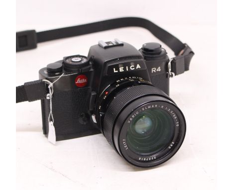 Leica: A Leitz Wetzlar, Leica R4 black camera body, Serial No. 1599322. With attached Leitz Vario-Elmar-R, 1:3.5/35-70 E60, 3
