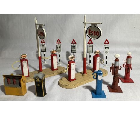 Dinky: A pair of unboxed Dinky Esso forecourt Petrol Pump island sets, together with additional various individual pumps and 