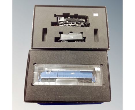 A Bachmann Spectrum 86030 HO GE-8-40CW diesel locomotive together with Bachmann Spectrum 11472 HO Baldwin 2-8-0 Consolidation