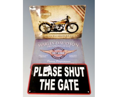 Two Harley Davidson signs and a "please shut the gate" sign 