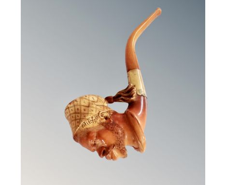 A Meerschaum pipe in the form of an African man  CONDITION REPORT: There is no box with this. It measures approximately 19 cm