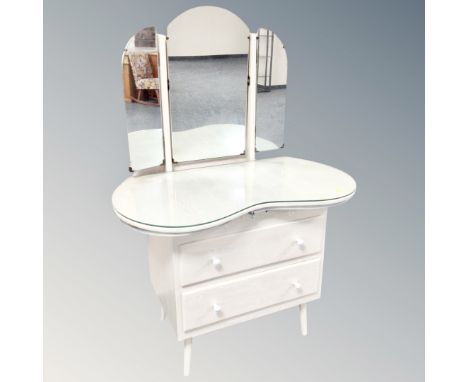A two drawer kidney shaped dressing table with triple mirror in washed oak finish 
