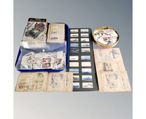 A tray of vintage cigarette card albums with cigarette cards, loose cards, tin of stamps, a bundle of Dalesman magazines 