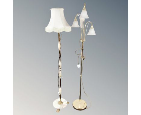 A gilt and onyx standard lamp with shade together with three-way floor lamp 