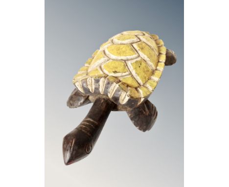 A carved wooden and painted African figuer of a turtle, N.E. Nigeria near Lake Chad associate with the spirits of the water. 