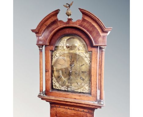 A Victorian oak longcase clock with brass dial, pendulum and weights, the dial marked 'Hutchinson, Leeds'. CONDITION REPORT: 