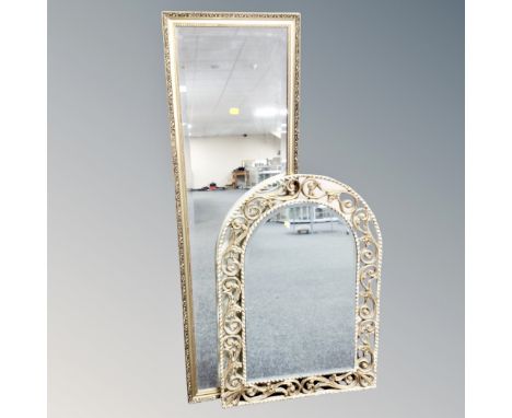 A cream and gilt decorative arch topped bevelled mirror together with gilt framed hall mirror 