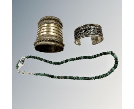 A white metal tribal cuff bracelet, a further bangle and a hardstone bead necklace with silver clasp. 