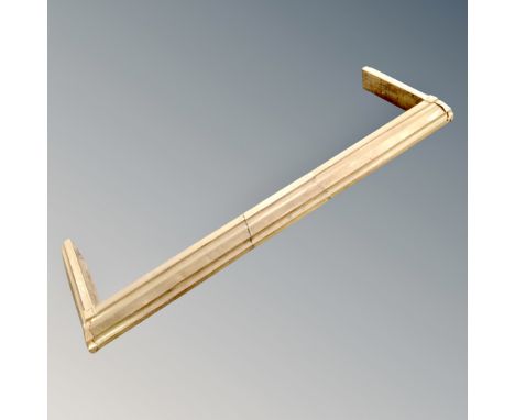 A vintage brass fire curb 