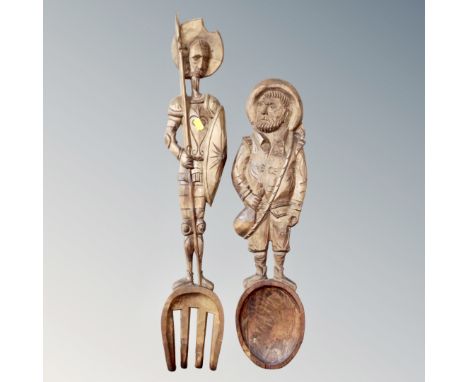A vintage carved Don Quixote oversized wooden fork and spoon 