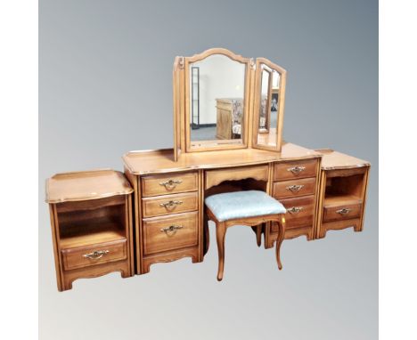A four piece Pierre Fontaine Collection bedroom suite comprising of kneehole twin pedestal dressing table fitted with seven d