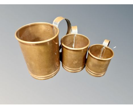 A graduated set of three vintage copper tankards 