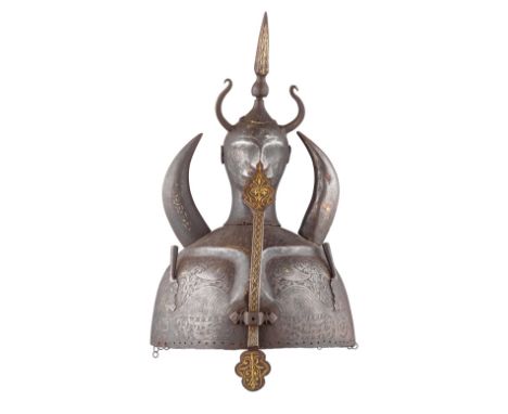 ‡ A PERSIAN HELMET (KULAH KHUD), QAJAR, 19TH CENTURY with hemispherical skull embossed with a demonic mask on the front, etch