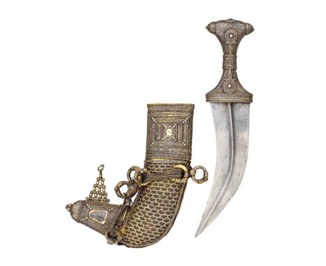 ‡ AN ARAB SILVER-MOUNTED DAGGER (JAMBIYA), LATE 19TH CENTURY with curved medially ridged double-edged blade, the hilt entirel