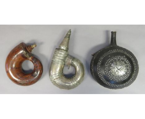 A SILVER-MOUNTED INDO-ARAB POWDER-FLASK AND TWO FURTHER INDIAN FLASKS, 19TH CENTURY the first with tightly curled metal body,