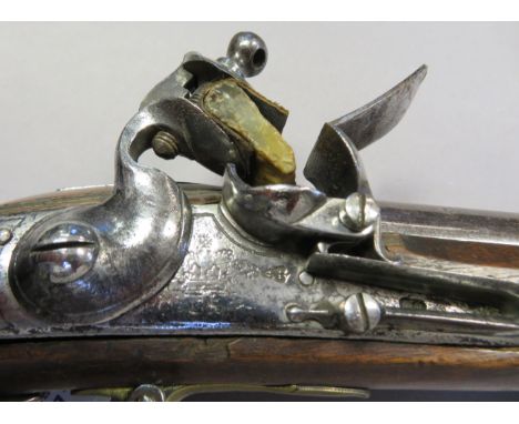 A .750 CALIBRE INDIAN PATTERN FLINTLOCK MUSKET, LATE 18TH/EARLY 19TH CENTURY of regulation type, with tapering barrel, struck