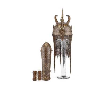 ‡ A PERSIAN HELMET (KULAH-KHUD) AND ARM DEFENCE (BAZU BAND), QAJAR, SECOND HALF OF THE 19TH CENTURY the first with hemispheri