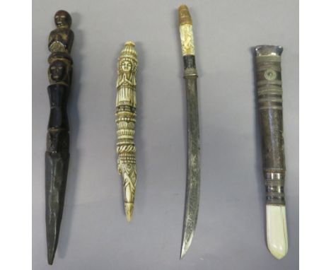 ˜TWO BURMESE DHA DAGGERS, LATE 19TH CENTURY AND TWO CEREMONIAL DAGGERS the first with curved blade decorated with silver scro