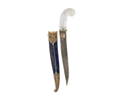 ‡ AN INDIAN DAGGER (KHANJAR), 19TH CENTURY with slightly curved double-edged blade of watered steel, decorated with a panel o
