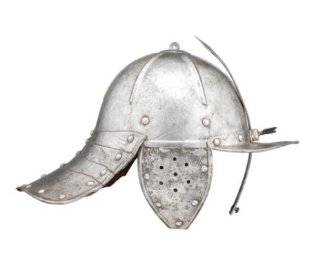 A GERMAN ZISCHÄGGE, MID-17TH CENTURY with hemispherical one-piece skull embossed with six radiating ribs, fitted at its apex 