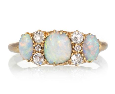 OPAL AND DIAMOND RING, set with cabochon opals interspaced by pairs of diamonds, in eighteen carat gold, shank misshapen, app
